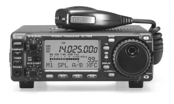 Front view of IC703 with microphone resting on top. The radio is tuned to 14.025mhz