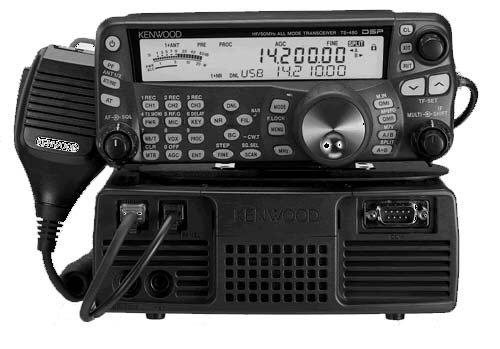 Image of the Kenwood Ts-480. The face plate is sat on top of the radio body. The microphone is to the left of the body. The radio is tuned to 14.200mhz.